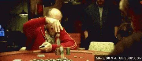 Image of a poker player putting in a raise, but doing so in a manner that gives off a poker tell.