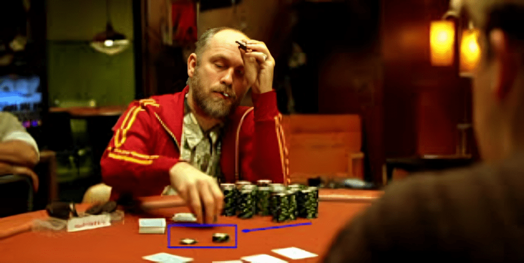 Image reflecting a famous scene from the poker movie "Rounders" where one of the players is exhibiting a strong poker tell.