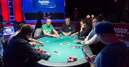 Image showing a Texas Hold'em poker game in progress.
